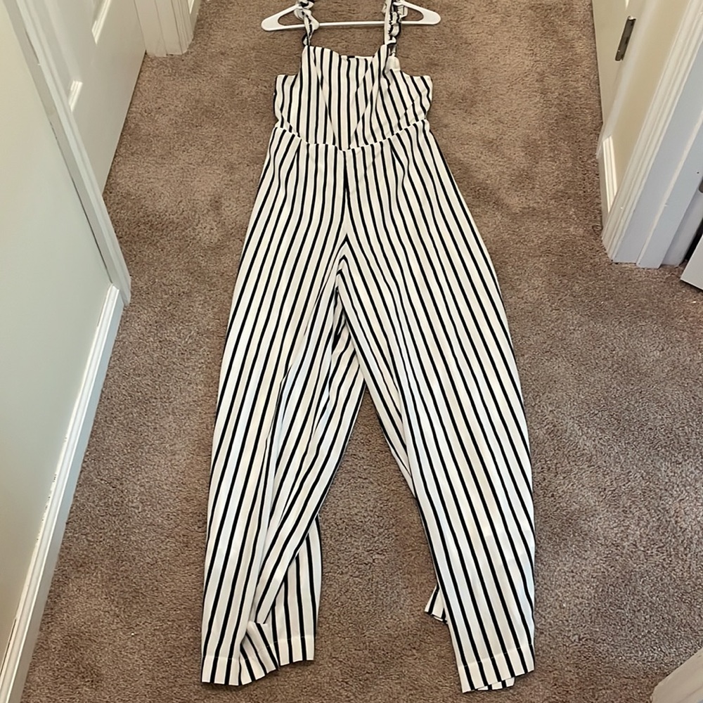 Black and white jumpsuit with open back